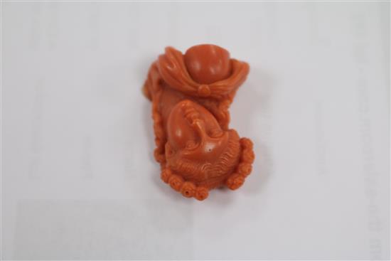 A carved coral bust of a lady (ex brooch mounted), 33mm.